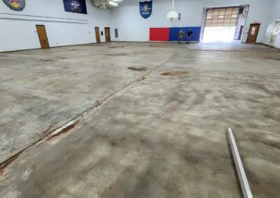 Valley City National Guard Armory basketball court stripped of asbestos tile and mastic.