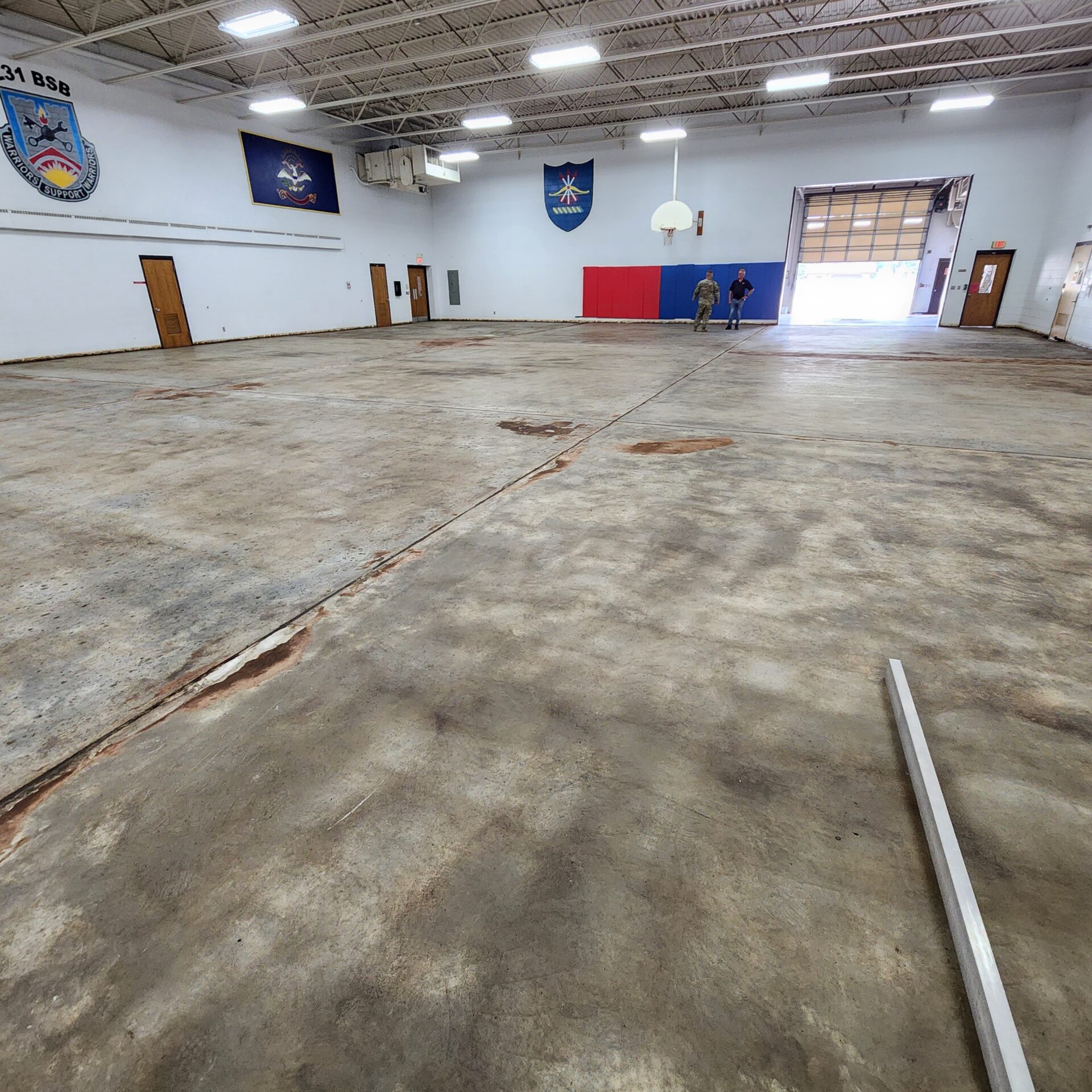Valley City National Guard Armory basketball court stripped of asbestos tile and mastic. 