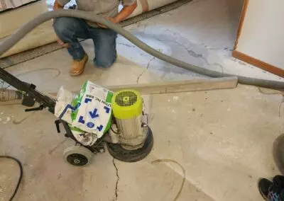 Using a Wolff Neo 230 grinder to prep a floor for WPC flooring.