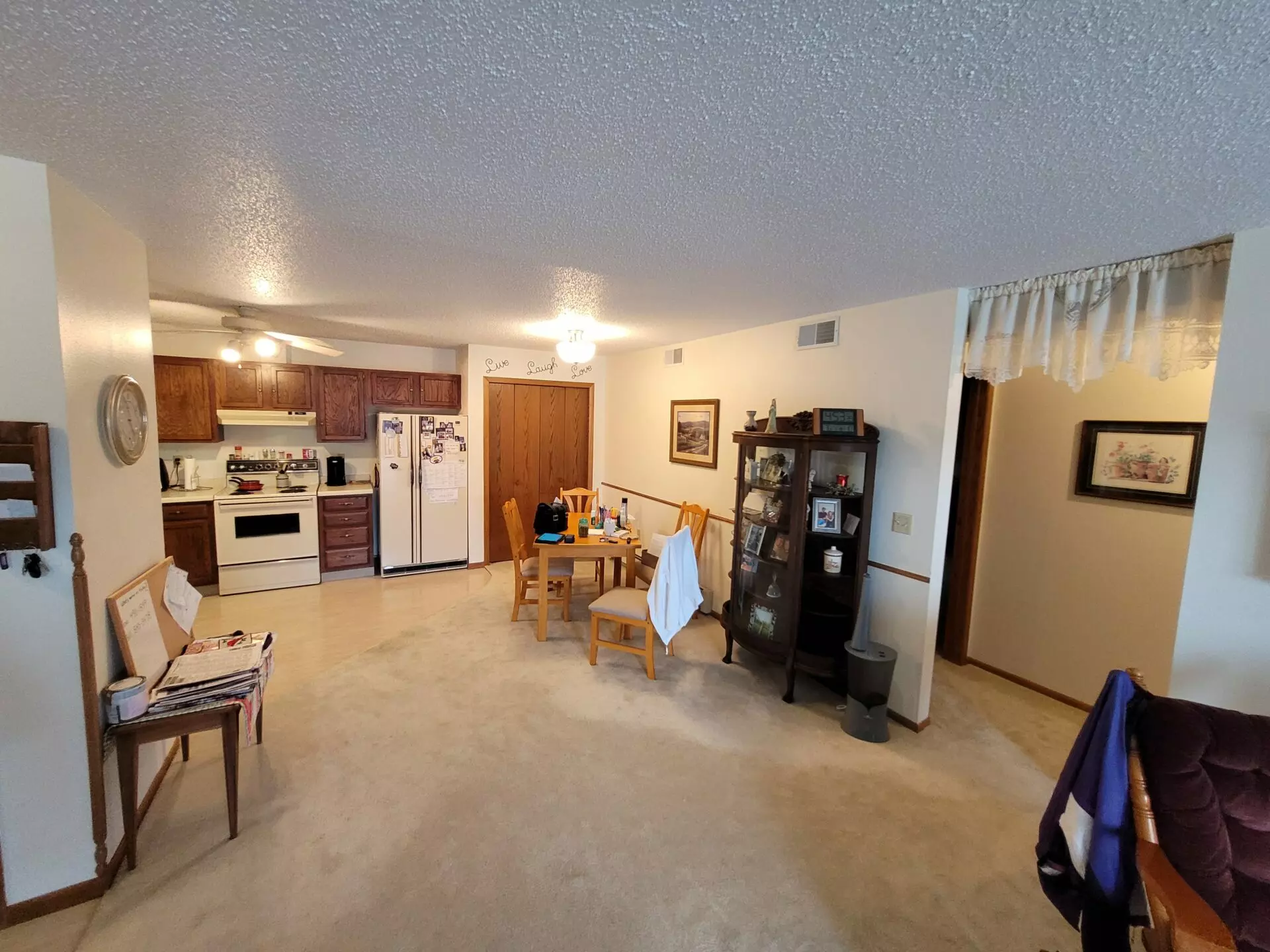 Sheet viny in kitchen and carpet in a dining area in Valley City, ND.